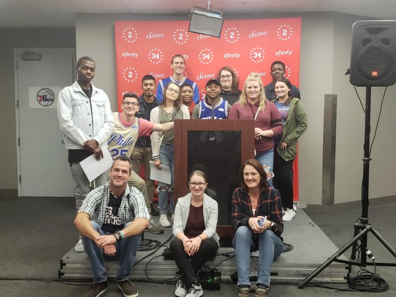 Delaware Tech students touring the Philadelphia 76ers press room are in back (l-r) Howard Mumford, Brayden Ostan, Edward Deleon, Jana Ruark, John Kyritsis, Lauren Moon, Safi Furlow, Carson Williamson, Tristin West, Lester Fair and Kylie Brown. In front are Communications Department Chair Rob Rector, Educational Lab Specialist Chelsea Wootten and instructor Jessica Farley. SUBMITTED PHOTOS